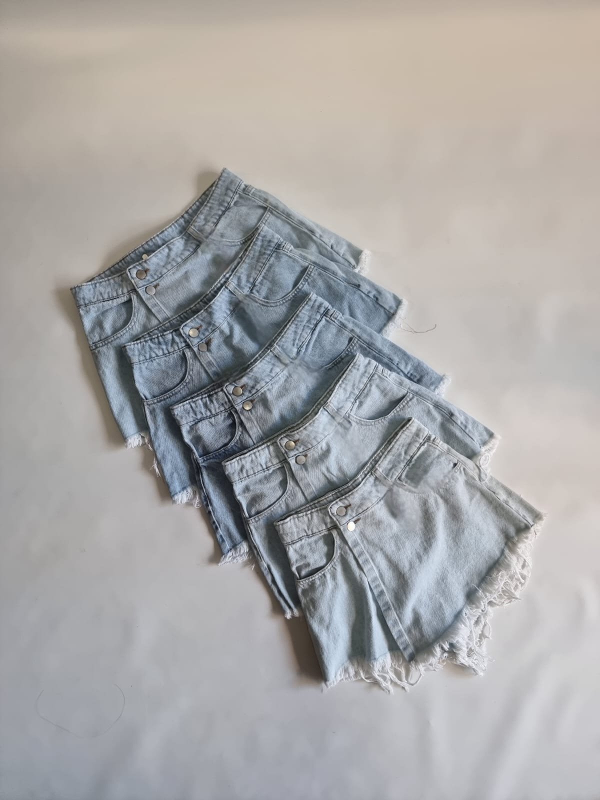 SHORT POLLERA CON BOTON