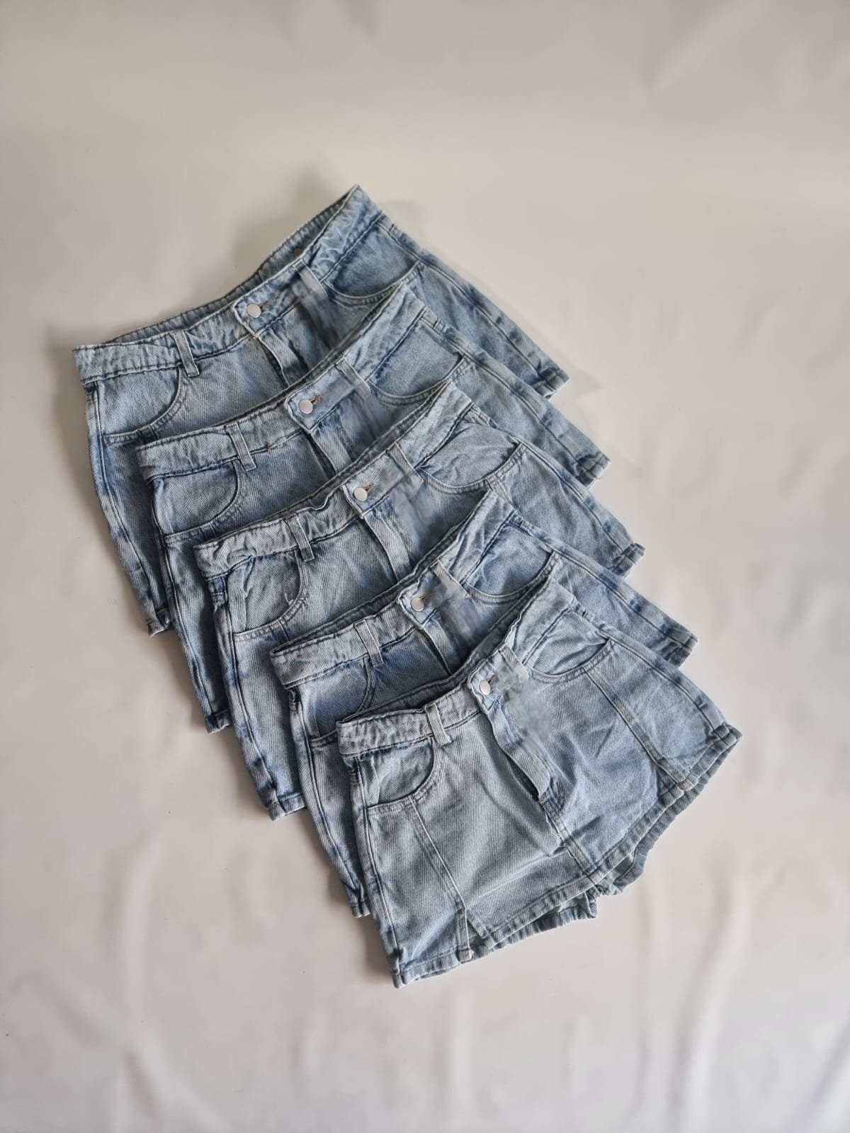 SHORT POLLERA 2 PINZAS  CELESTE NEVADO